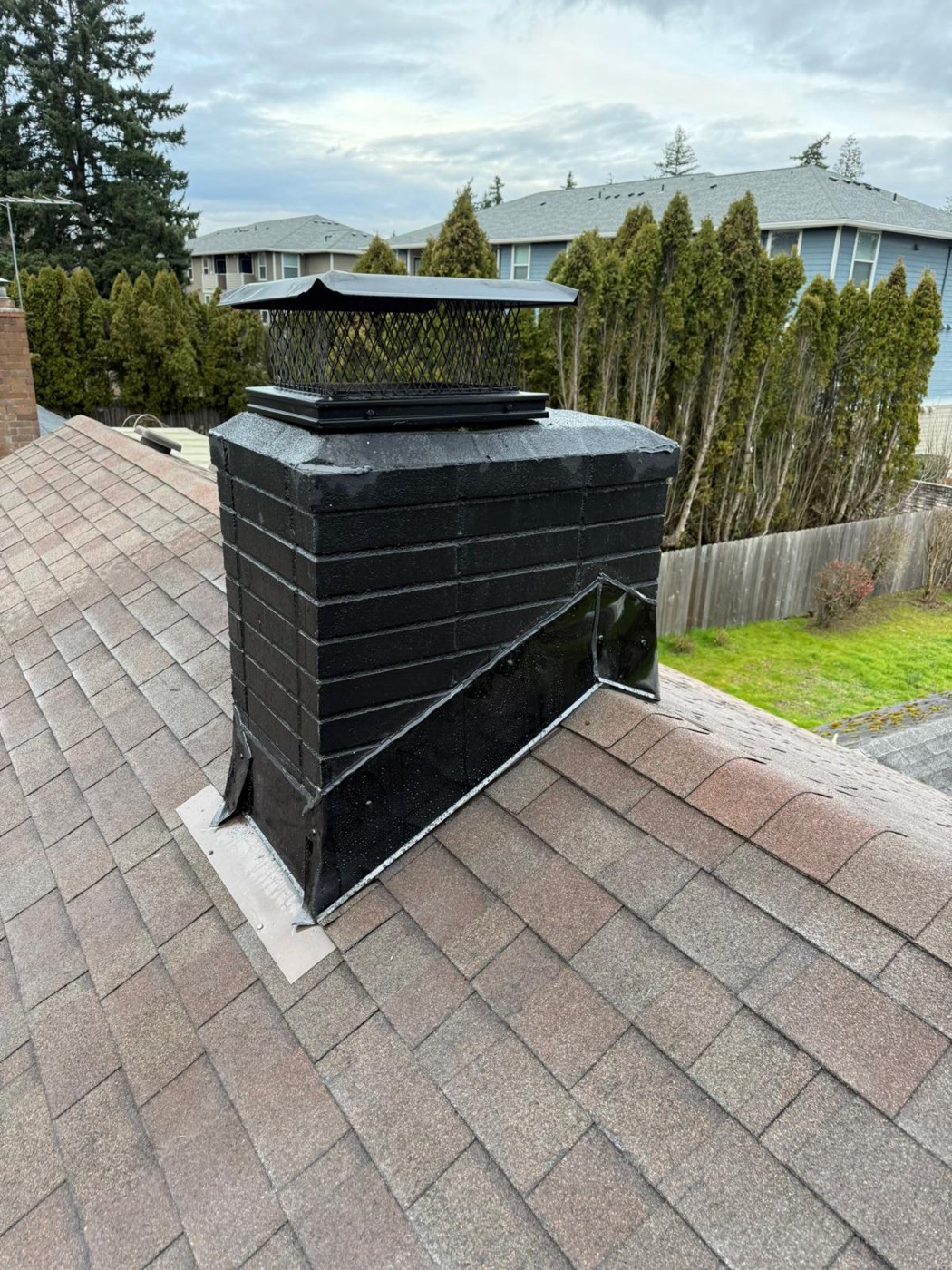 Sealed and painted chimney with new flashing